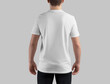 Mockup of white t-shirt on guy in dark jeans, back view, blank clothes for design, pattern, branding, advertising.