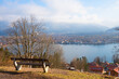 viewpoint Leeberg hill with bench, Rottach-Egern at the opposite lakeside Tegernsee
