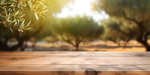 Mock up wooden table with green olive twig and blurry green outdoor background 