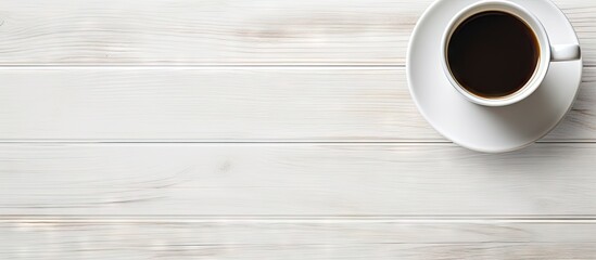 Wall Mural - an isolated white desk with a coffee cup placed in the center provides a clean and empty surface cop
