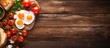 A delicious breakfast spread with fried eggs and tomato toasts beautifully arranged on a rustic wooden cutting board creating an inviting copy space image