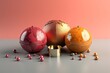 Three chocolate balls with golden continents on pink background.