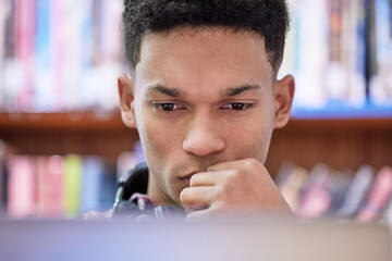 Fototapete - Man, student and thinking on library computer, studying and learning knowledge on school website. Male person, college and online course for information, contemplation and internet for university
