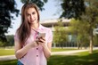 Happy young woman check smartphone,