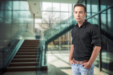 Wall Mural - Happy young businessman leader standing in office.