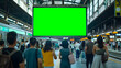 © Tanakorn - Green Billboard Display at Busy Train Station Attracts Commuter Attention on Sunny Summer Day