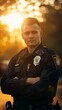 A police officer is standing with a commanding presence in front of a vibrant sunset, showcasing dedication and duty in a peaceful environment.