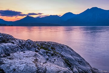 Wall Mural - a photo of a mountain lake surrounded by the mountains at dusk
