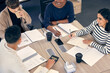 © peopleimages.com - Team diversity, startup and strategy for business with people from above for planning, budget and brainstorming at table. Men, women and together in meeting with notebook for collaboration and goals