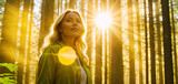 Fototapeta  - A woman enjoys the sun while walking in the forest