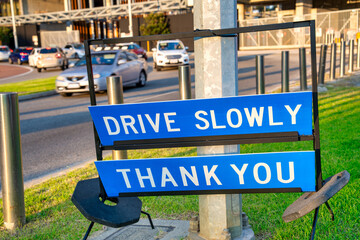 Poster - Drive slowly road sign in Australia