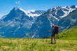 © Kotangens - Sporty woman hiking in Switzerland alps. Heathy lifestyle, sport, beauty in nature. Grindelwald valley, Swizz
