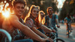 © Elena - A group of young friends enjoying a bike ride in a park at sunset, with warm light highlighting their smiles