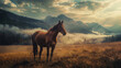 Majestic horse standing in misty mountain landscape at sunrise