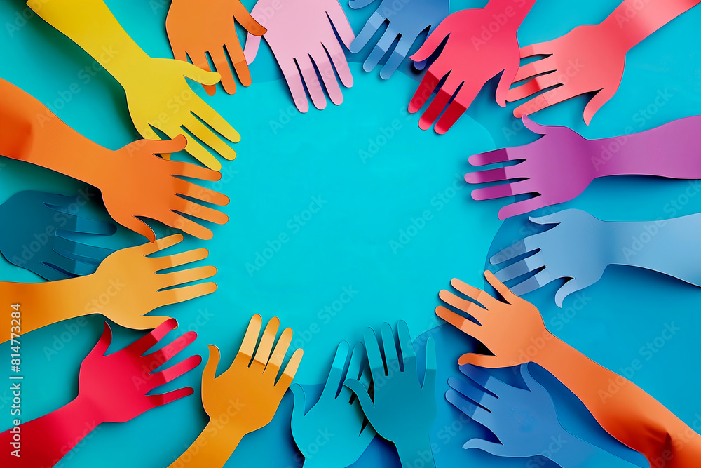 Overhead view of paper hands in a circle, symbolizing unity and ...
