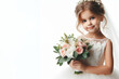 © Ольга Лукьяненко - Little girl in a wedding dress holding a bouquet of flowers Isolated on white background