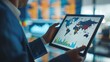 © chanidapa - A businessman analyzing international economic graphs on a digital tablet, strategizing for global market fluctuations.