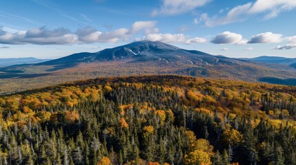 Wall Mural - Aerial view of the Mount Mansfield in Vermont, USA, the highest mountain in the state, offering expansive views of the su
