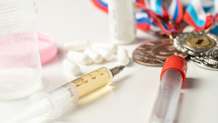 Athletes' medals against the background of doping. Doping for an athlete. Concept of doping products and testing of athletes for banned substances. Doping test at the Olympics. Concept of doping.