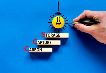 Wall Mural - CCS Carbon capture storage symbol. Concept words CCS Carbon capture storage on beautiful wooden blocks. Beautiful blue background. Business ecological Carbon capture storage concept. Copy space.