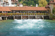 beautiful wooden weir with decorative flowers, Aare river Thun, switzerland Bernese Oberland