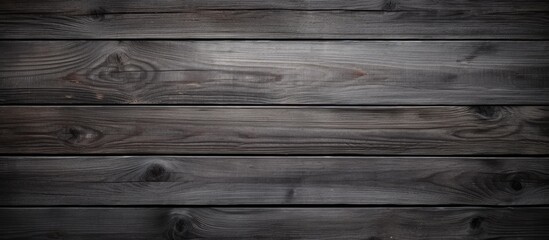 A wallpaper featuring a textured dark gray wooden surface that provides a copy space image