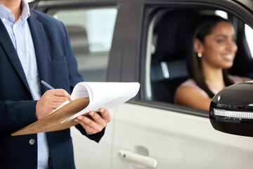 Sticker - Man, paperwork and standing by car at dealership with happy woman, document for inspection or contract. Sales, people and transportation with clipboard for check or application, new auto in showroom