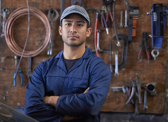 Wall Mural - Mechanic, man and portrait in workshop with tools, repair garage and automotive engineering for car maintenance. Professional, vehicle service and motor issues, confident employee and coveralls