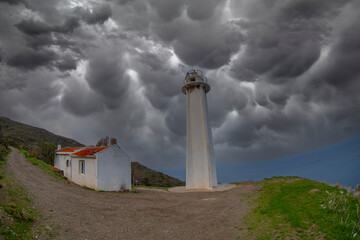 Wall Mural - Sarpıncık Lighthouse (Karaburun Lighthouse), with access to 12 miles of sight, has been in service in the direction of Urla-Karaburun in İzmir Çeşme Peninsula