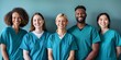 © gunzexx png and bg - Diverse group of healthcare professionals in medical scrubs smiling confidently at the camera