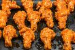 cooked chicken legs fried in batter, street food in Thailand, selective focus