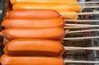 sausages on wooden skewers, selective focus