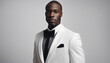© abu - Handsome african american man in tuxedo on white background