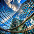 A low angle view of a futuristic office building with a unique curved glass window pattern. 