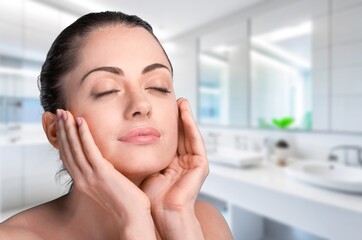 Wall Mural - Portrait of happy woman touches face with clean skin