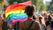LGBTQ+ individuals radiating love and joy, united under the rainbow flag