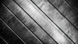 Detailed close-up of a monochrome brushed metal surface with light reflecting linear patterns