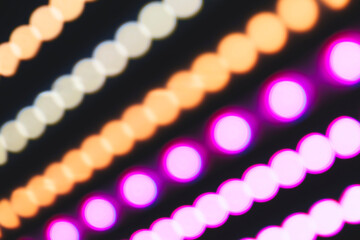 Wall Mural - a series of colorful lights are displayed in a row. the lights are in different colors and are arran