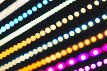 Wall Mural - a series of colorful lights are displayed in a row. the lights are in different colors and are arran
