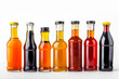 A row of bottles with different colored liquids.