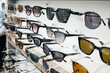 Large variety of prescription corrective sunglasses on display at optometrist office