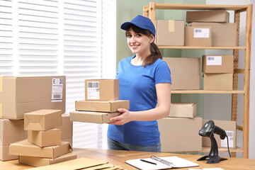 Sticker - Parcel packing. Post office worker with parcels at wooden table indoors