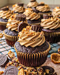 Chocolate cupcakes with peanut butter frosting and chocolate shavings