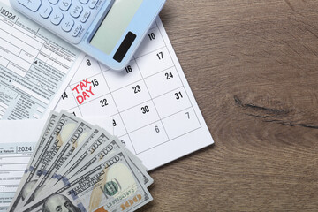 Wall Mural - Calendar with date reminder about tax day, documents, money and calculator on wooden table, top view. Space for text