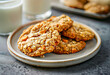Homemade oatmeal cookies with nuts and glass of milk