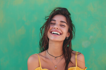 Wall Mural - Happy woman with a good style against Green background.