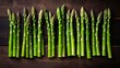 A row of green asparagus on a wooden table
