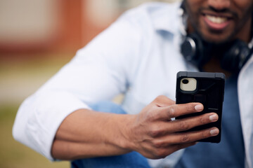 Fototapete - Man, student and hands typing with phone for social media, communication or reading news at college. Closeup of male person with smile on mobile smartphone for online chatting, outdoor texting or app
