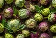 many fresh artichokes arranged in rows, on a wooden surface