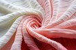 Elegant Pink and White Striped Textile Swirl Close-up.